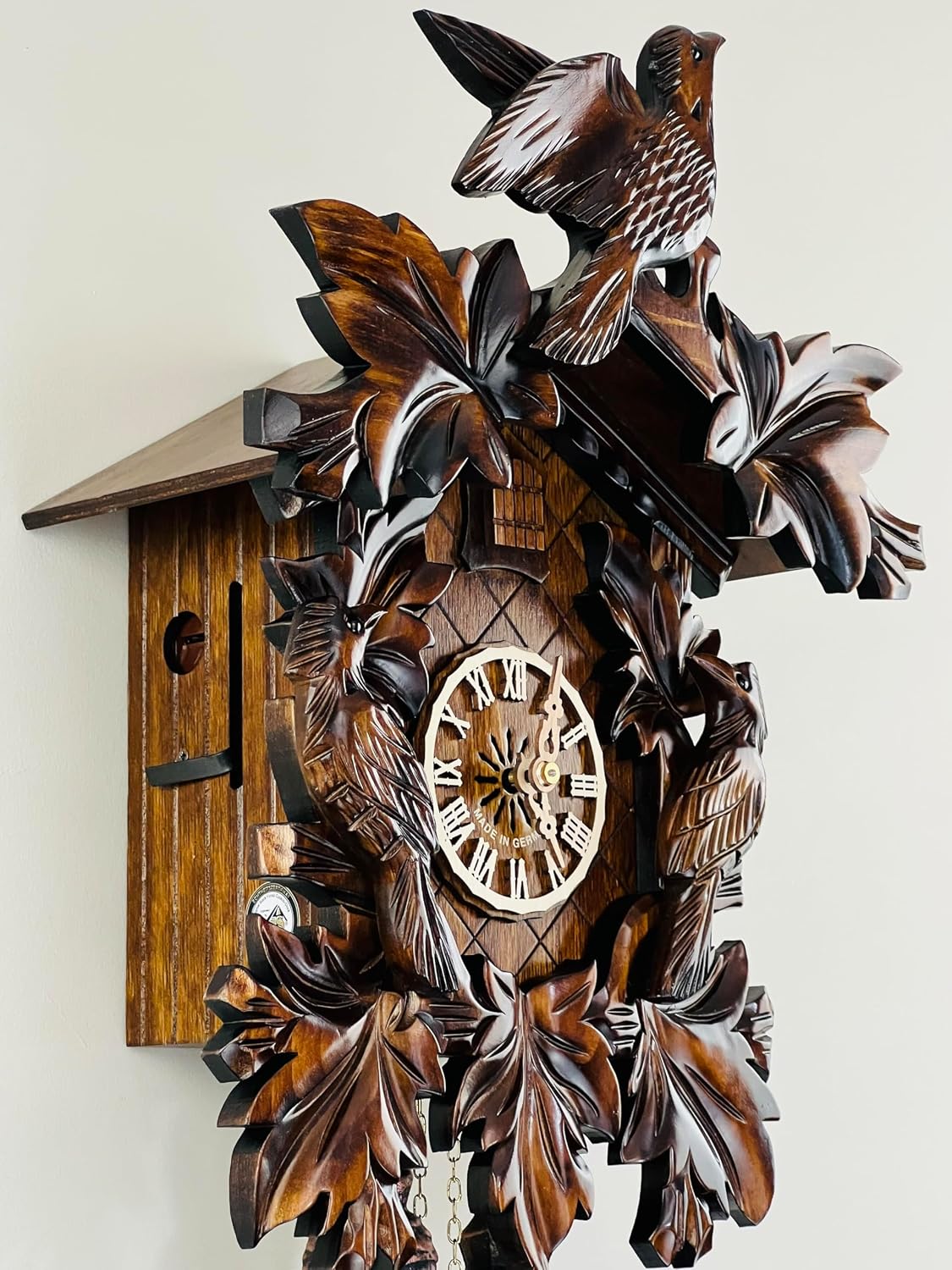 Eight Day Cuckoo Clock with Three Hand Carved Birds and Seven Leaves