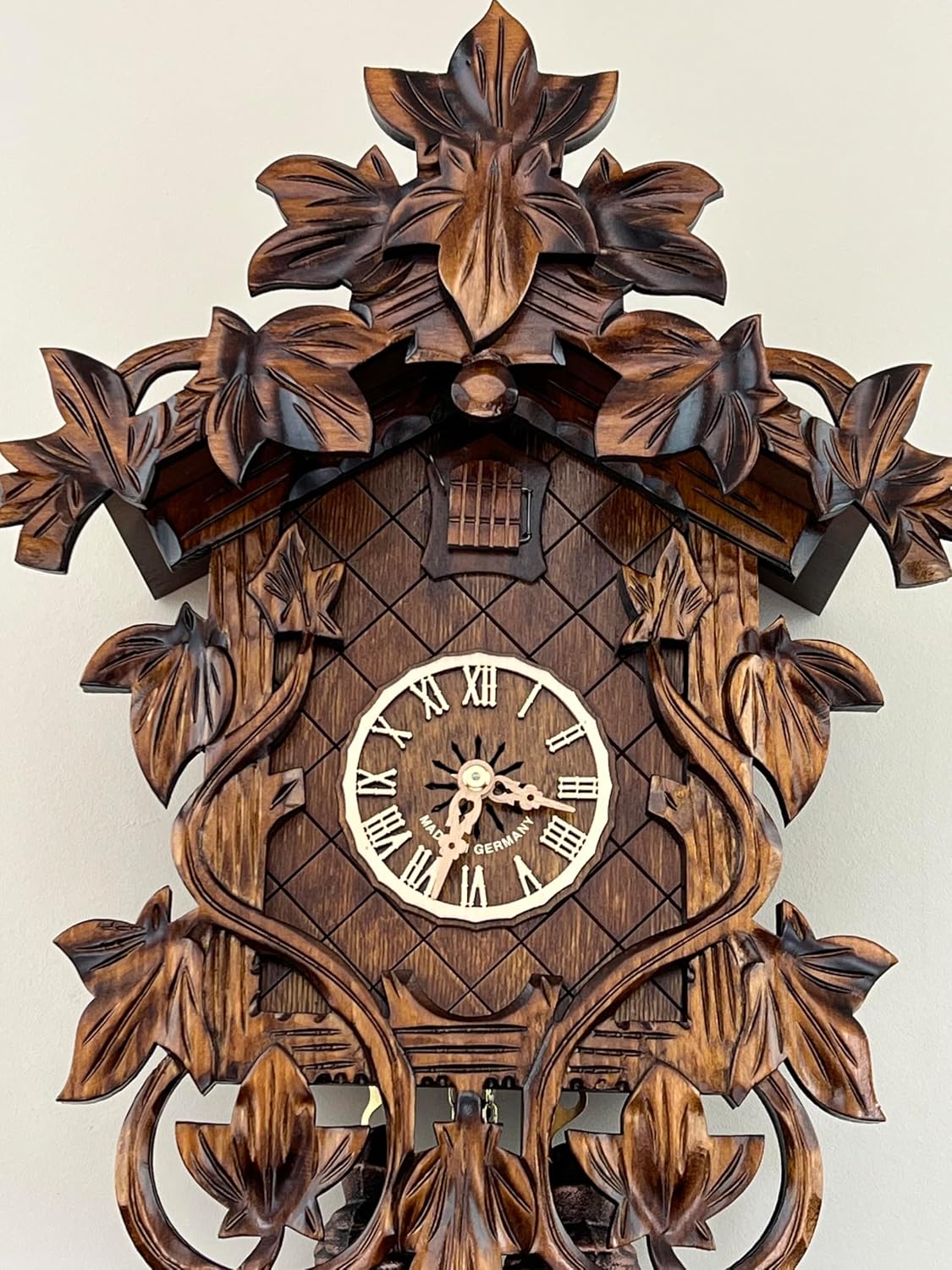 Eight Day Cuckoo Clock with Hand, Carved Vines and Leaves