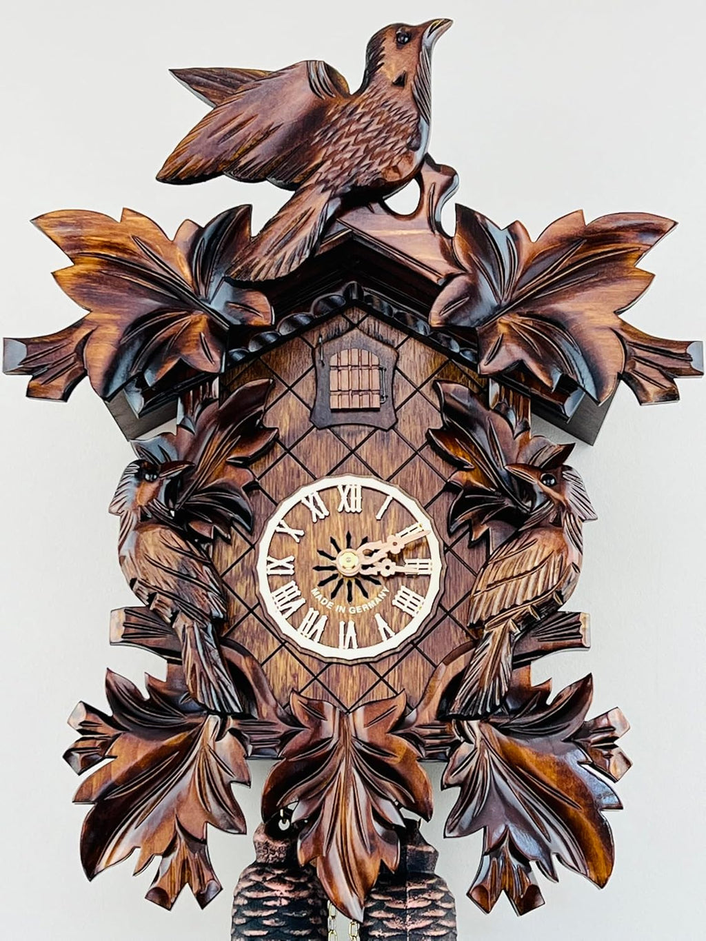 Eight Day Cuckoo Clock with Three Hand Carved Birds and Seven Leaves