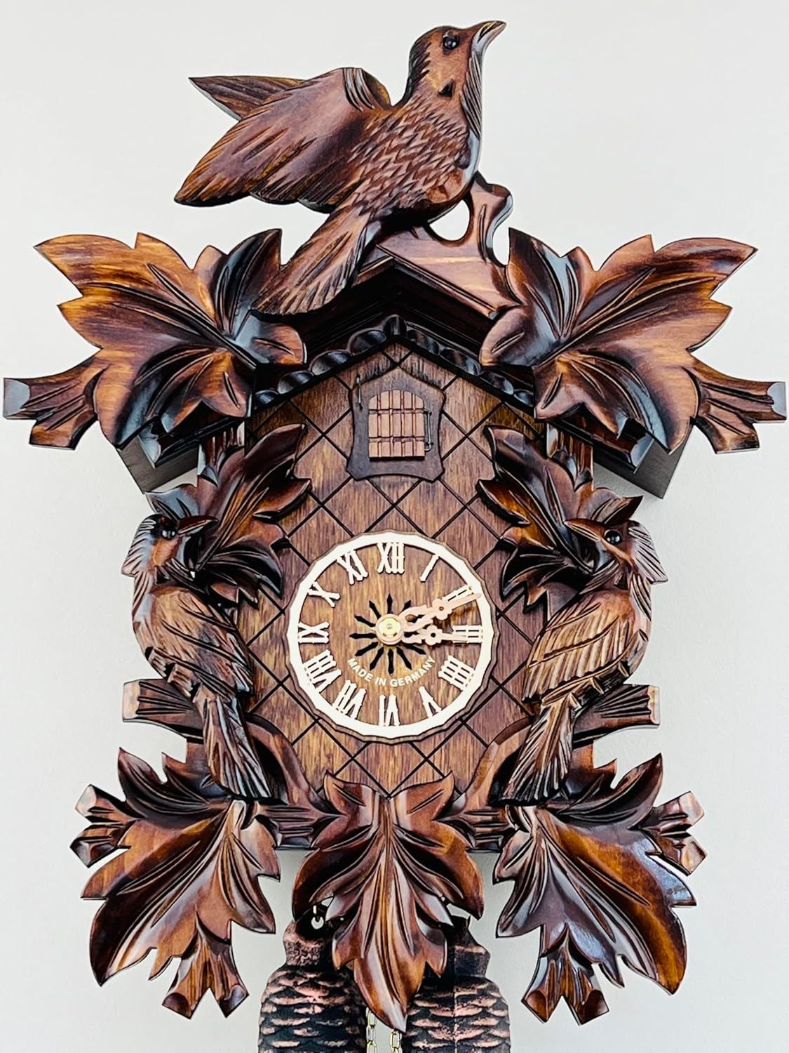 Eight Day Cuckoo Clock with Three Hand Carved Birds and Seven Leaves