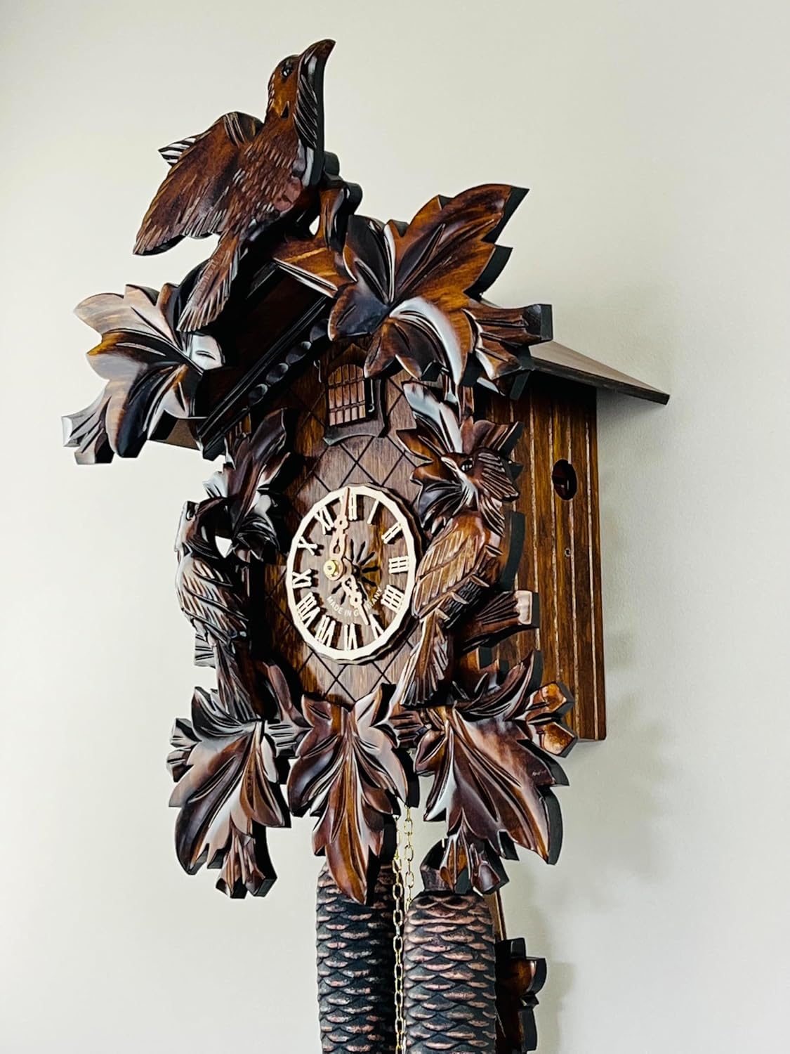 Eight Day Cuckoo Clock with Three Hand Carved Birds and Seven Leaves