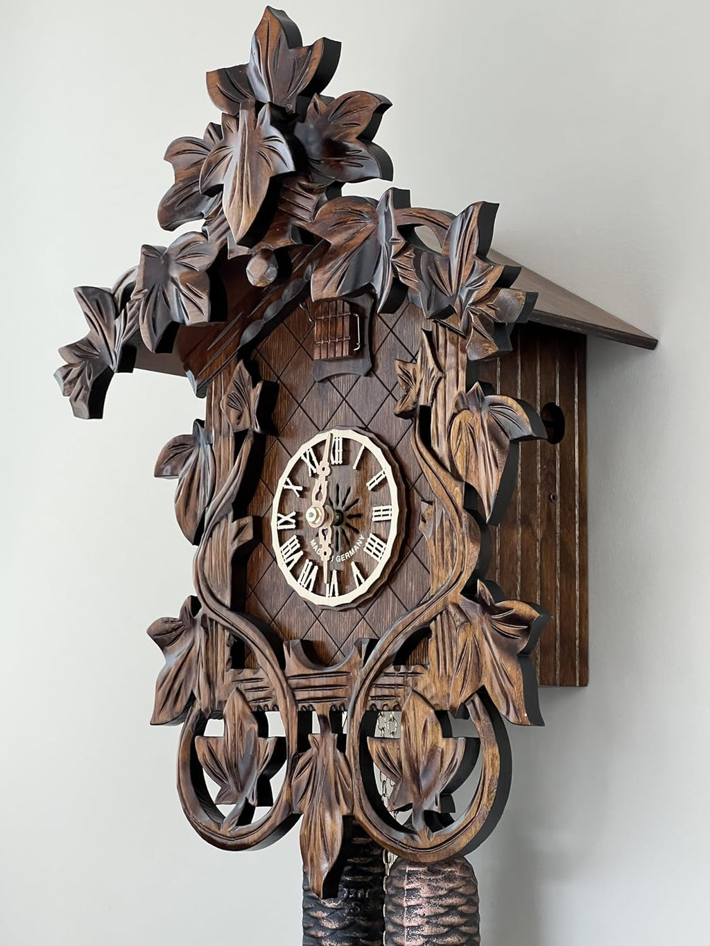 Eight Day Cuckoo Clock with Hand, Carved Vines and Leaves