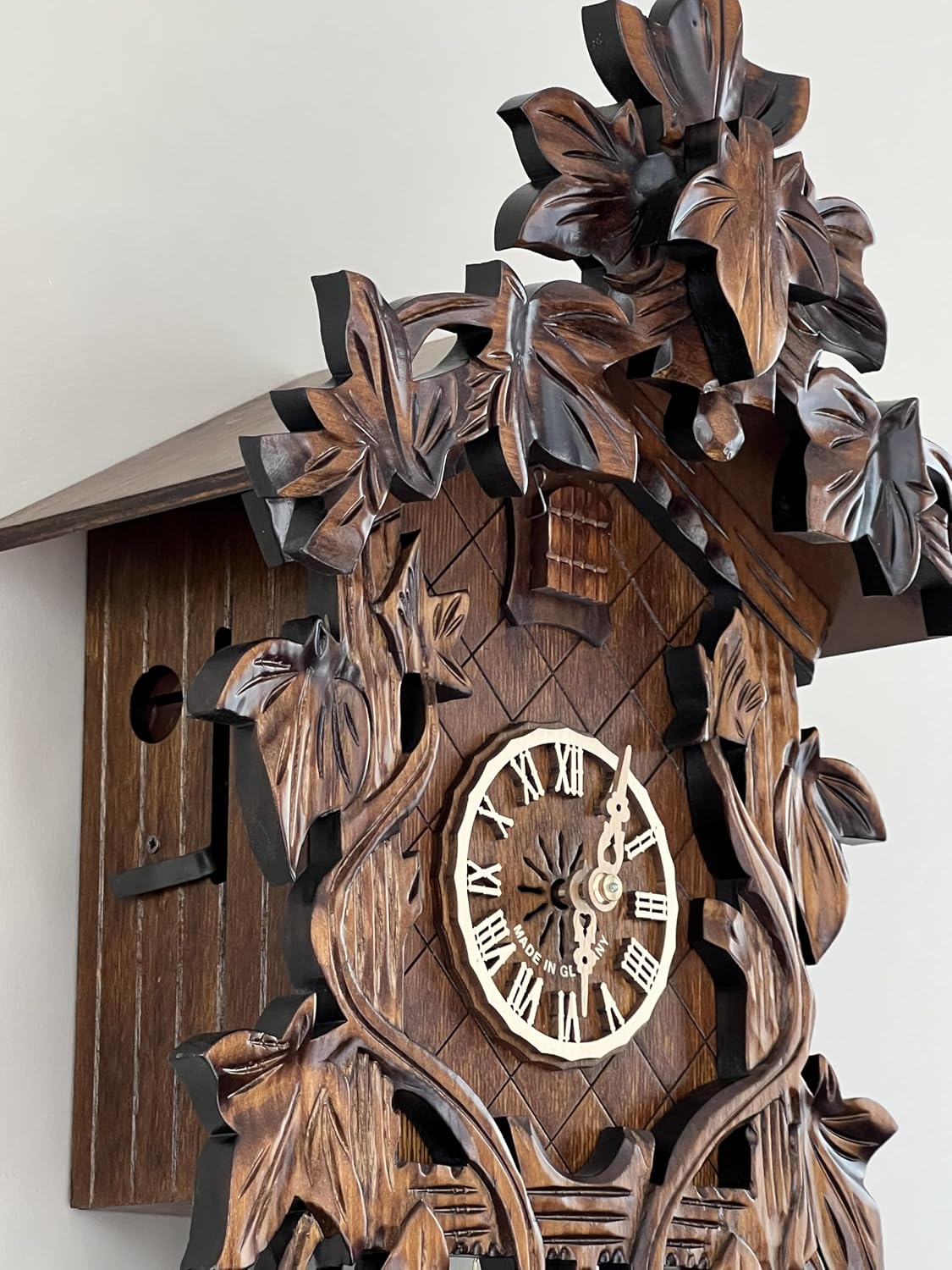Eight Day Cuckoo Clock with Hand, Carved Vines and Leaves